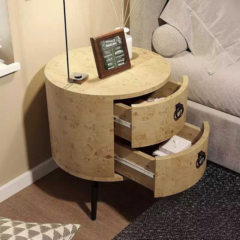 Tavolino rotondo, venatura del legno beige e gambe in metallo nero, 2 cassetti, uso singolo